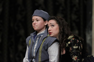 Olivia leans on the shoulder of Viola.